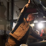 mechanic-examining-engine-auto_